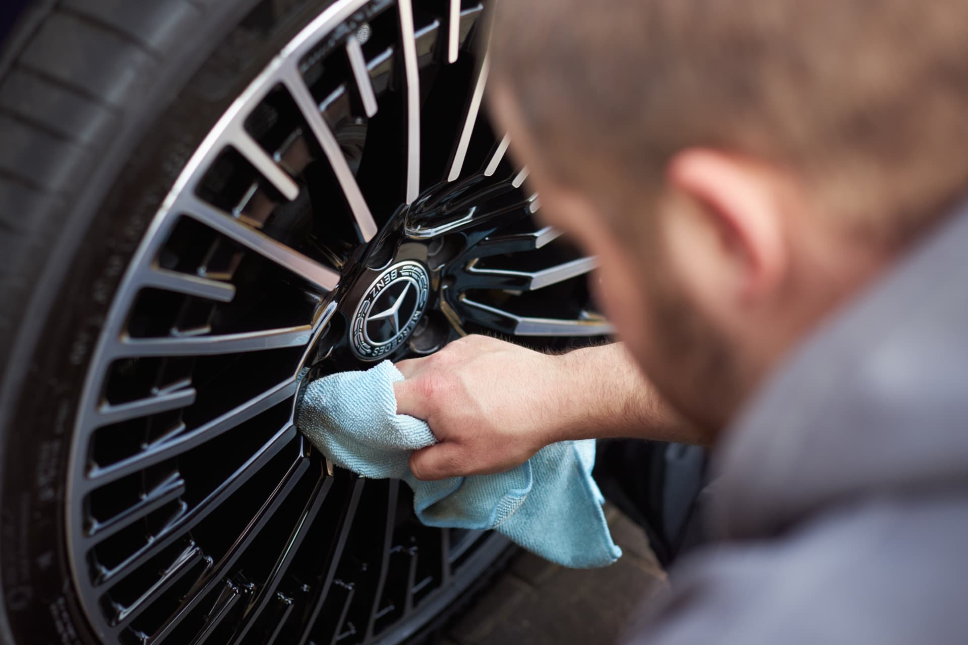 Filth technician detailing an alloy wheel